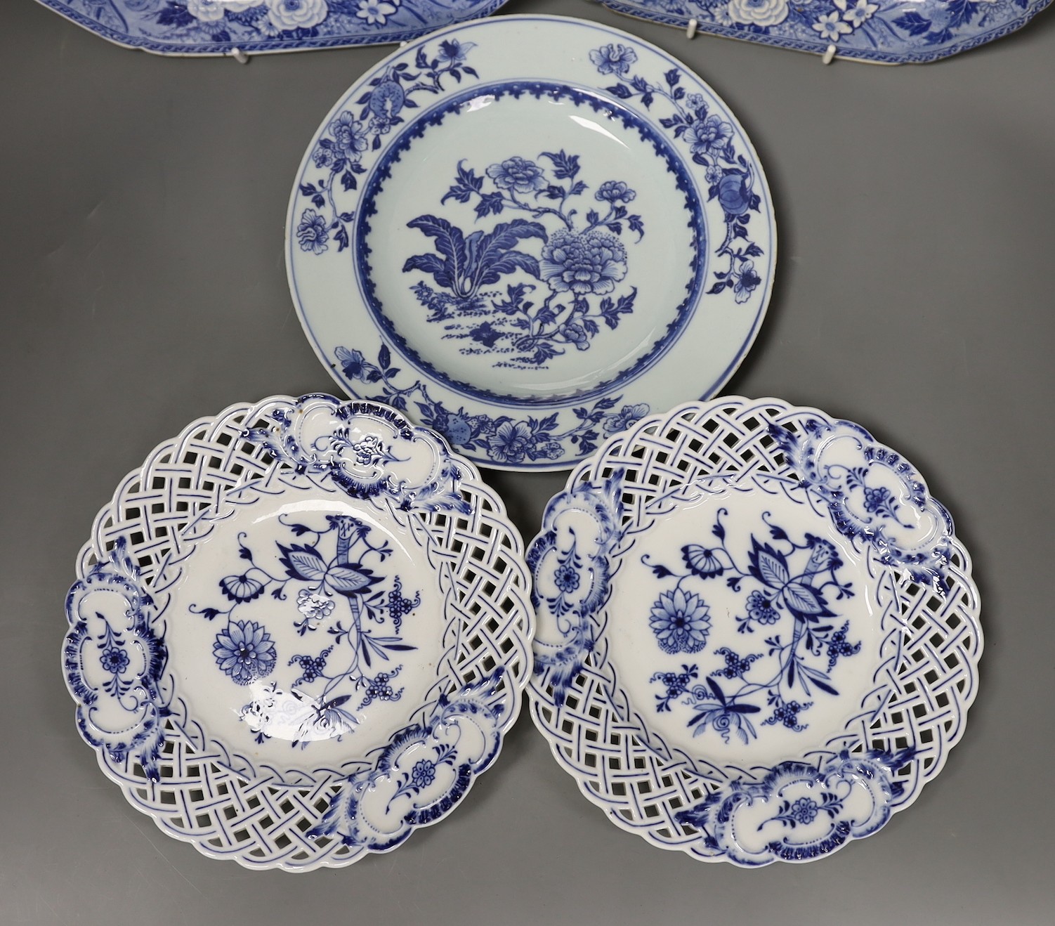 Three Meissen onion pattern plates, an 18th century Chinese exports blue and white plate and two pottery blue and white dishes, largest 27.5cm wide (5)